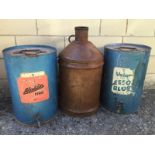 An Essoblue Valor five gallon paraffin drum, an Aladdin Pink Paraffin drum and a five gallon Castrol