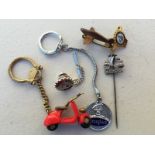 A collection of assorted Douglas related novelty keyrings including a scooter, a WWII plane etc.