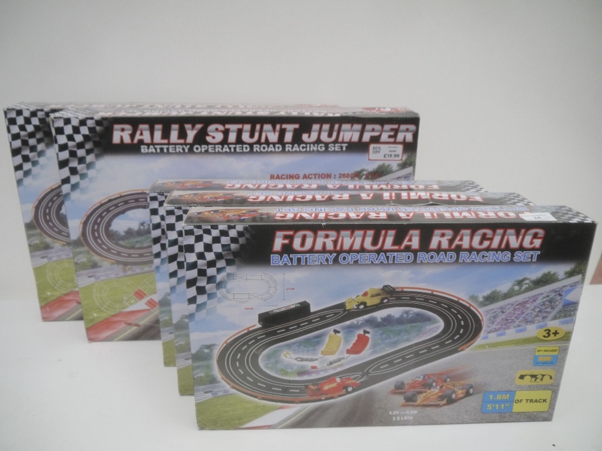 5x Battery Operated Road Racing Sets. ( 3 are Formula Racing & 2 are Rally Stunt Jumper) All boxed.