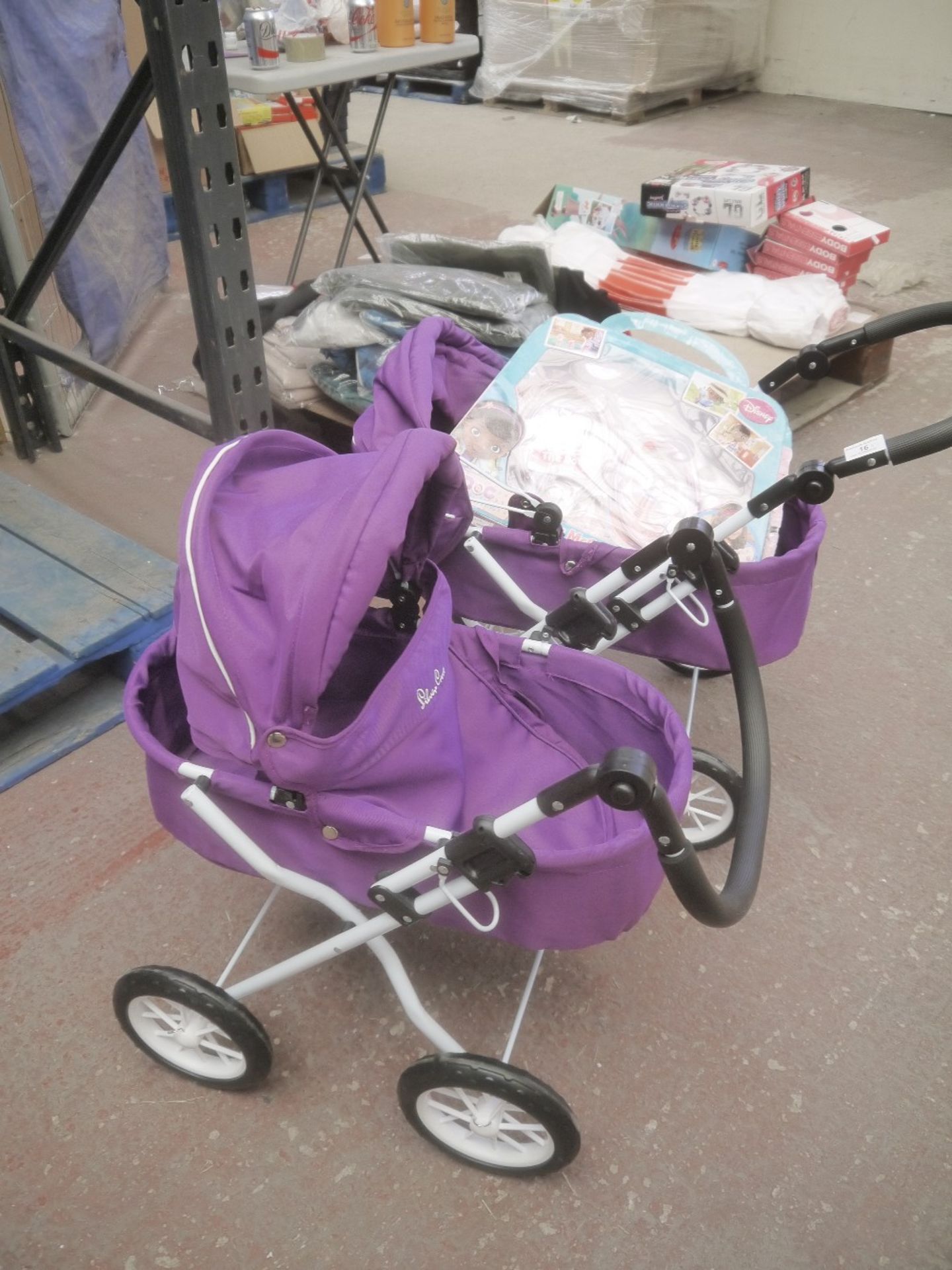 2x Silver Cross Doll Prams. And 1x Disney DocMcstuffins Doctor's Role Play Set.