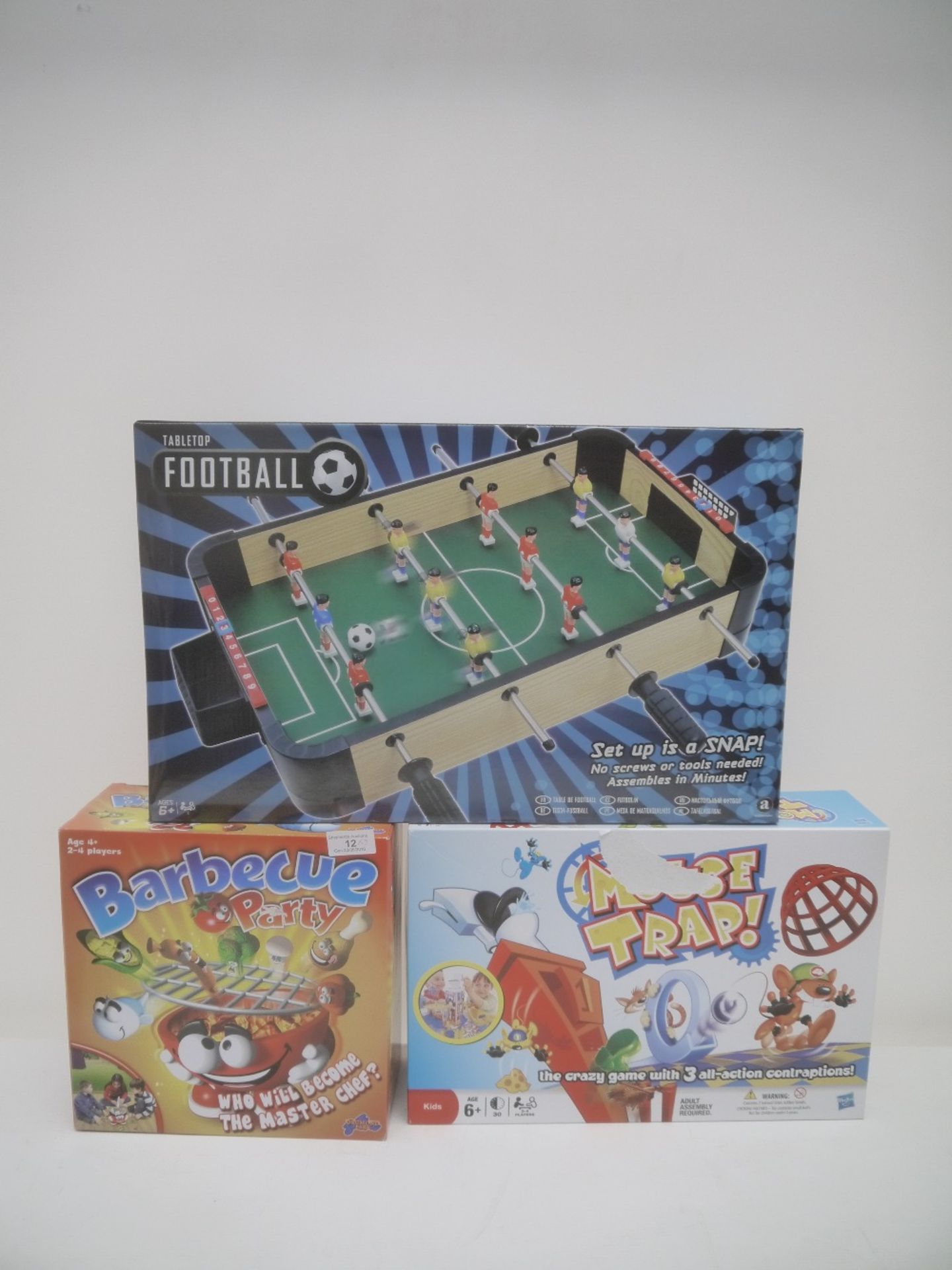 3x Toys in this lot, being the following; 1x Tabletop Football, 1x MouseTray Boardgame & 1x BBQ