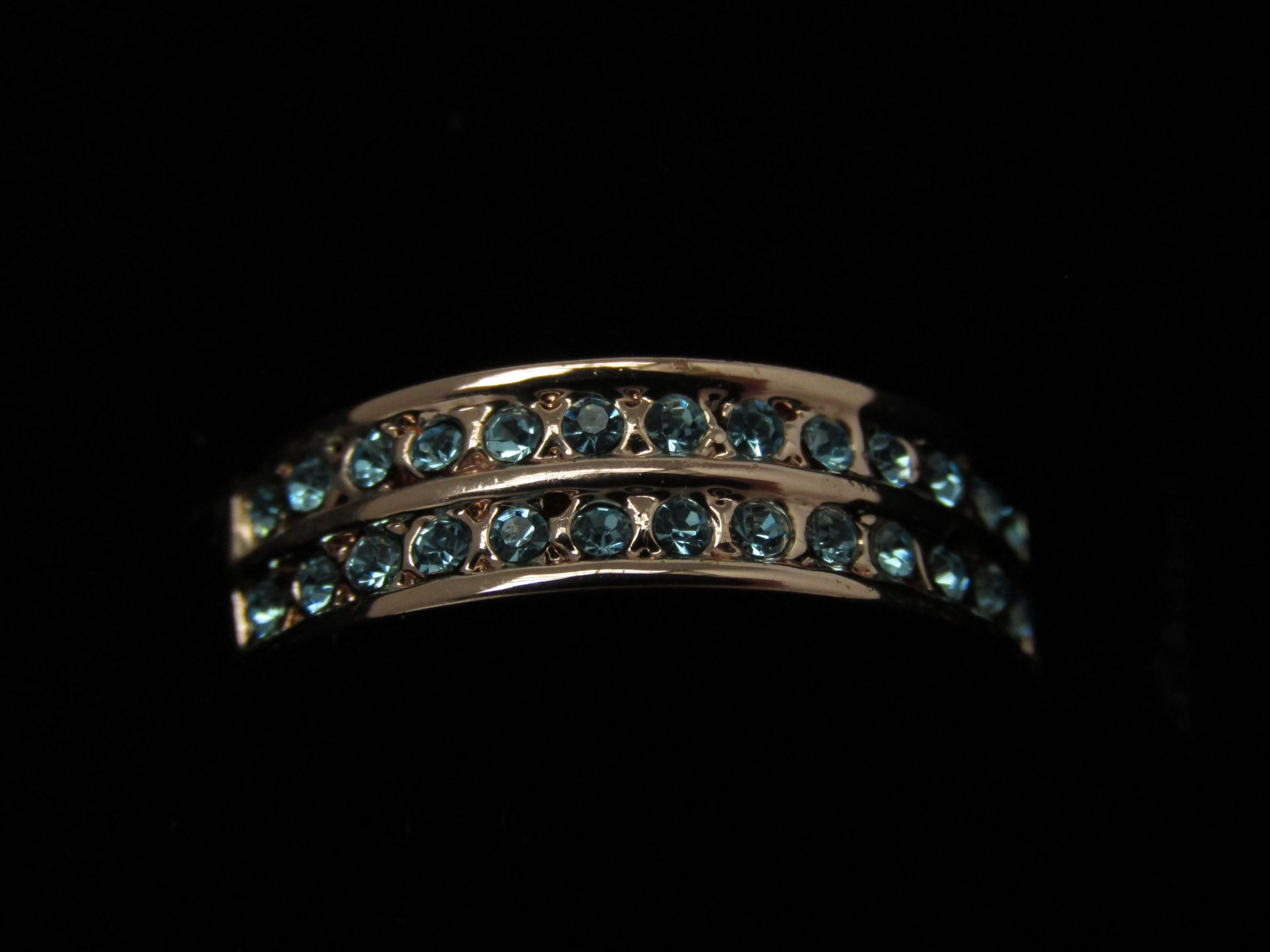 Fifth NYC Rose Gold plated half Eternity ring set with 26 of the clearest Aqua Blue Czech