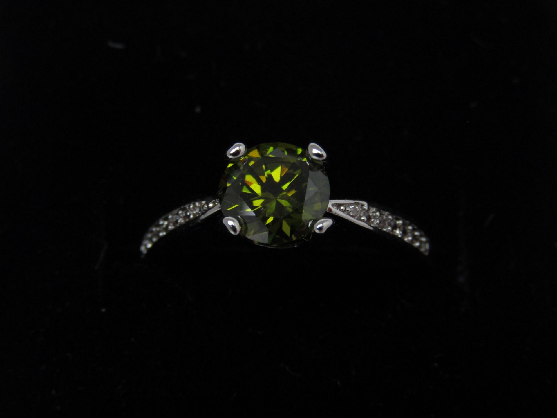 Fifth NYC White Gold Plated Timeless Ring set with a Olive Green Swarovski Element Crystal in the