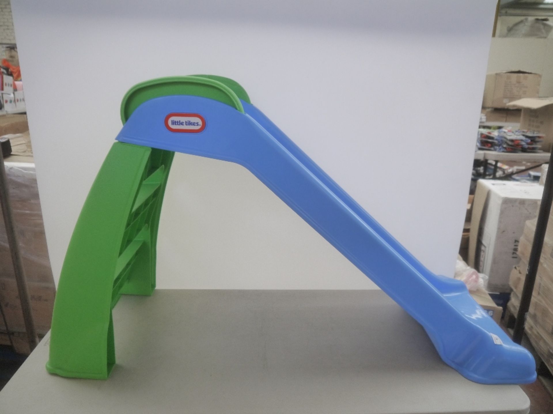 Children's small size slide, blue and green colour, appears to be in good condition.