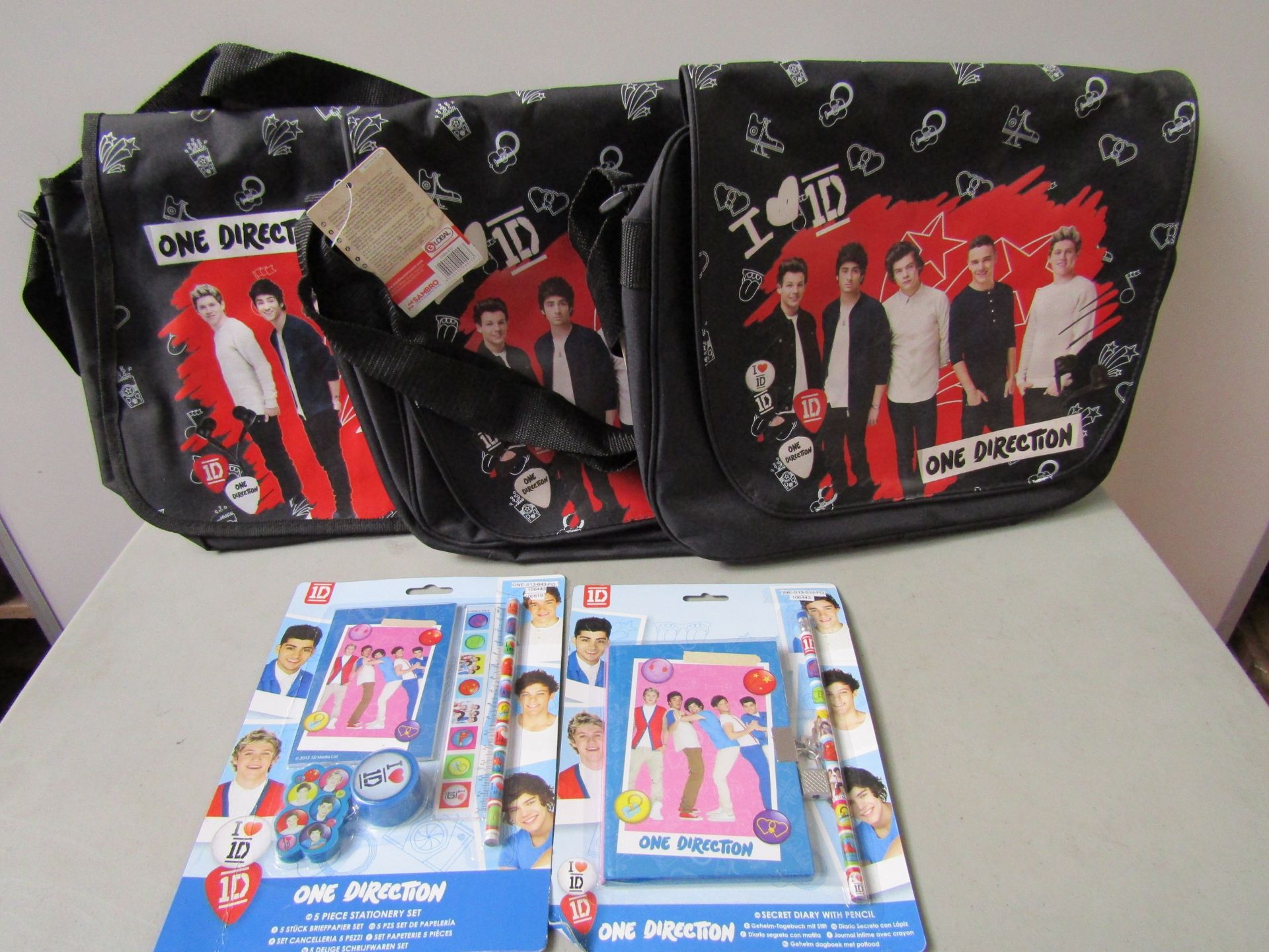5x Items Being: - 3x One Direction Black Satchel Bags - 2x One Direction Secret Diary with Pencil.