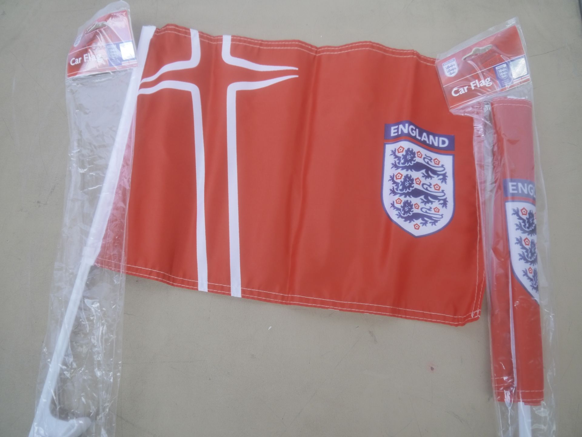 Box containing approx 72 England car flags, new and in packaging.