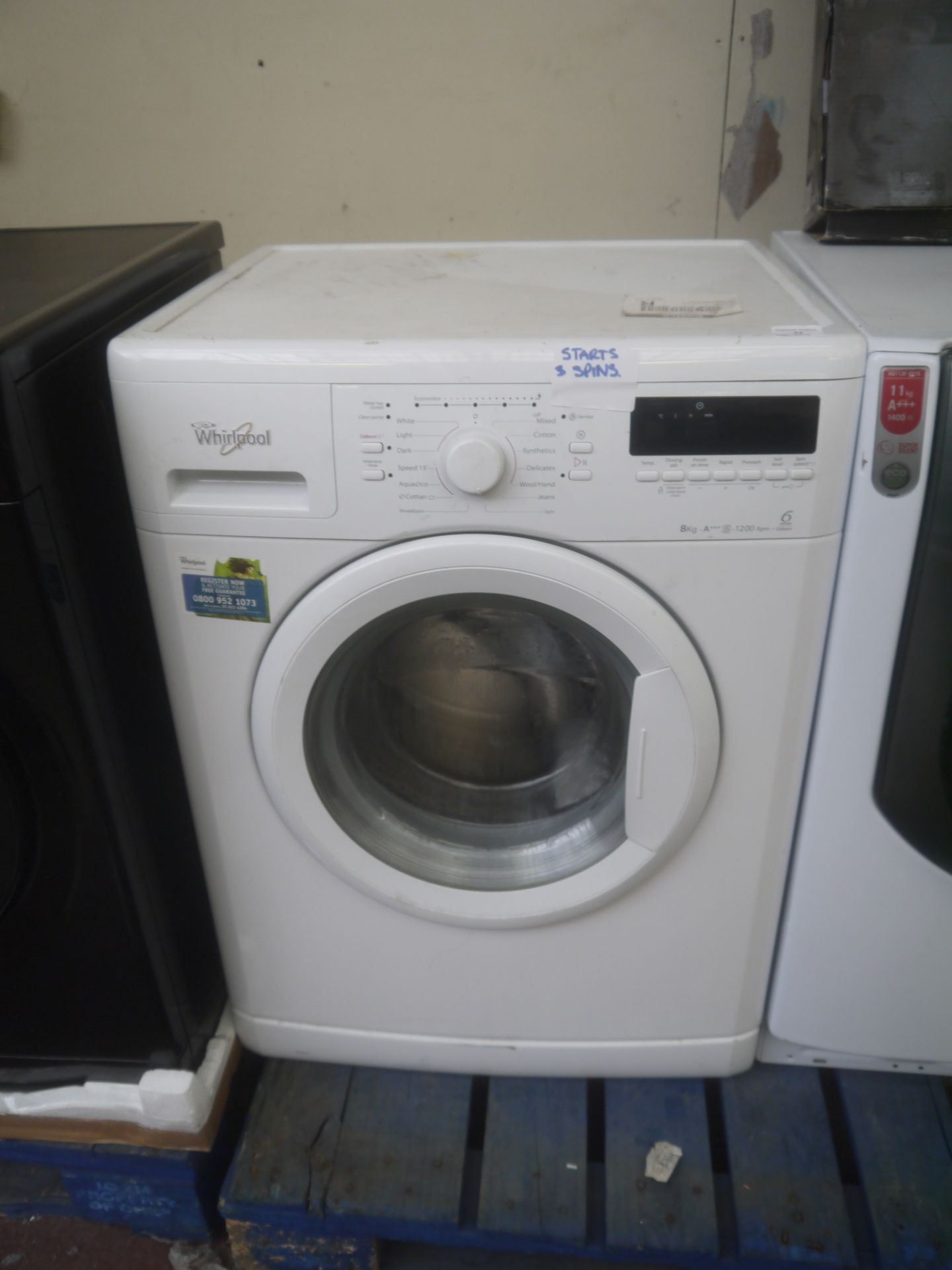 Whirlpool washing machine, 8kg, powers on and spins.