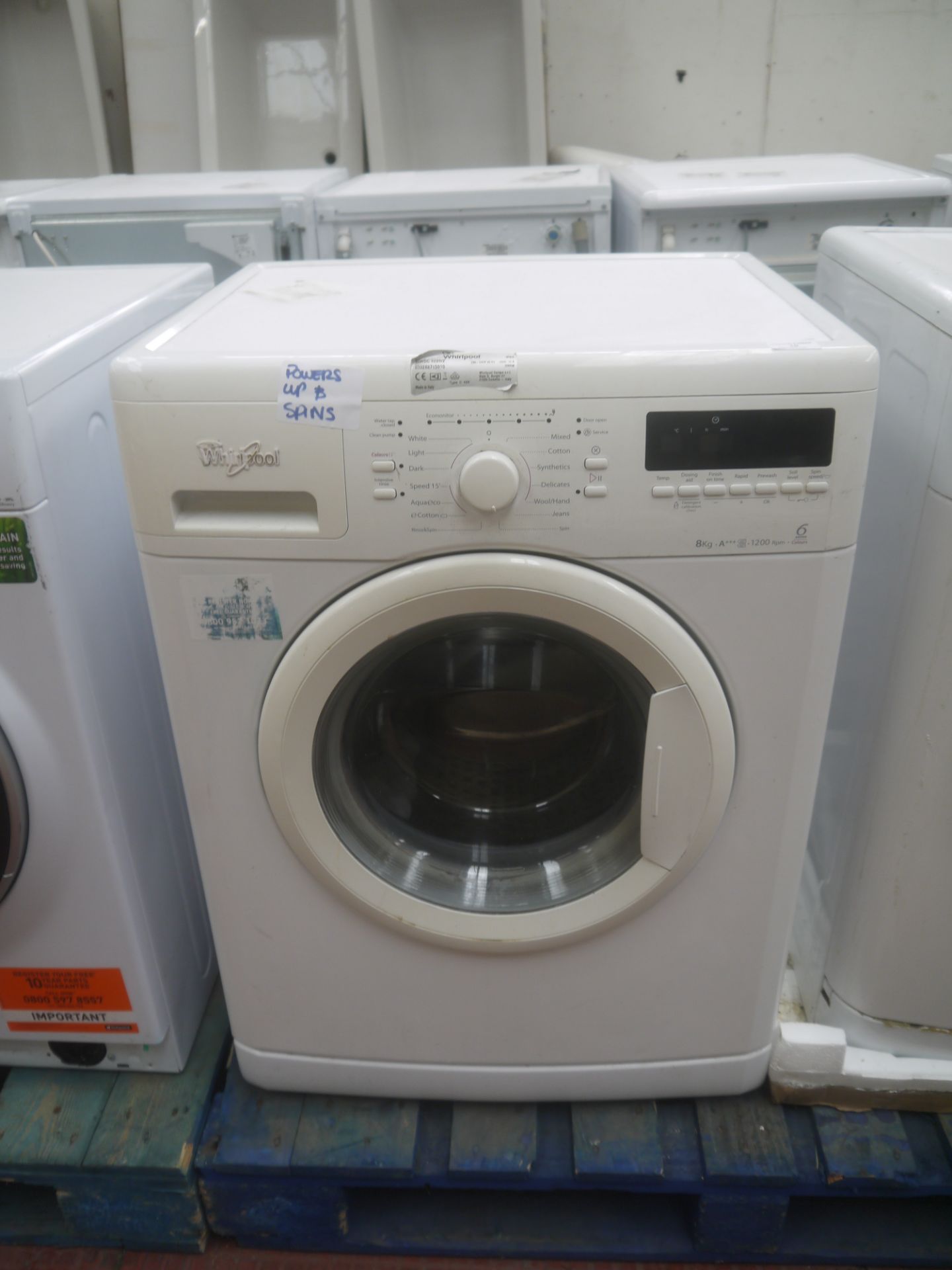 Whirlpool washing machine, 8kg, powers on and spins.