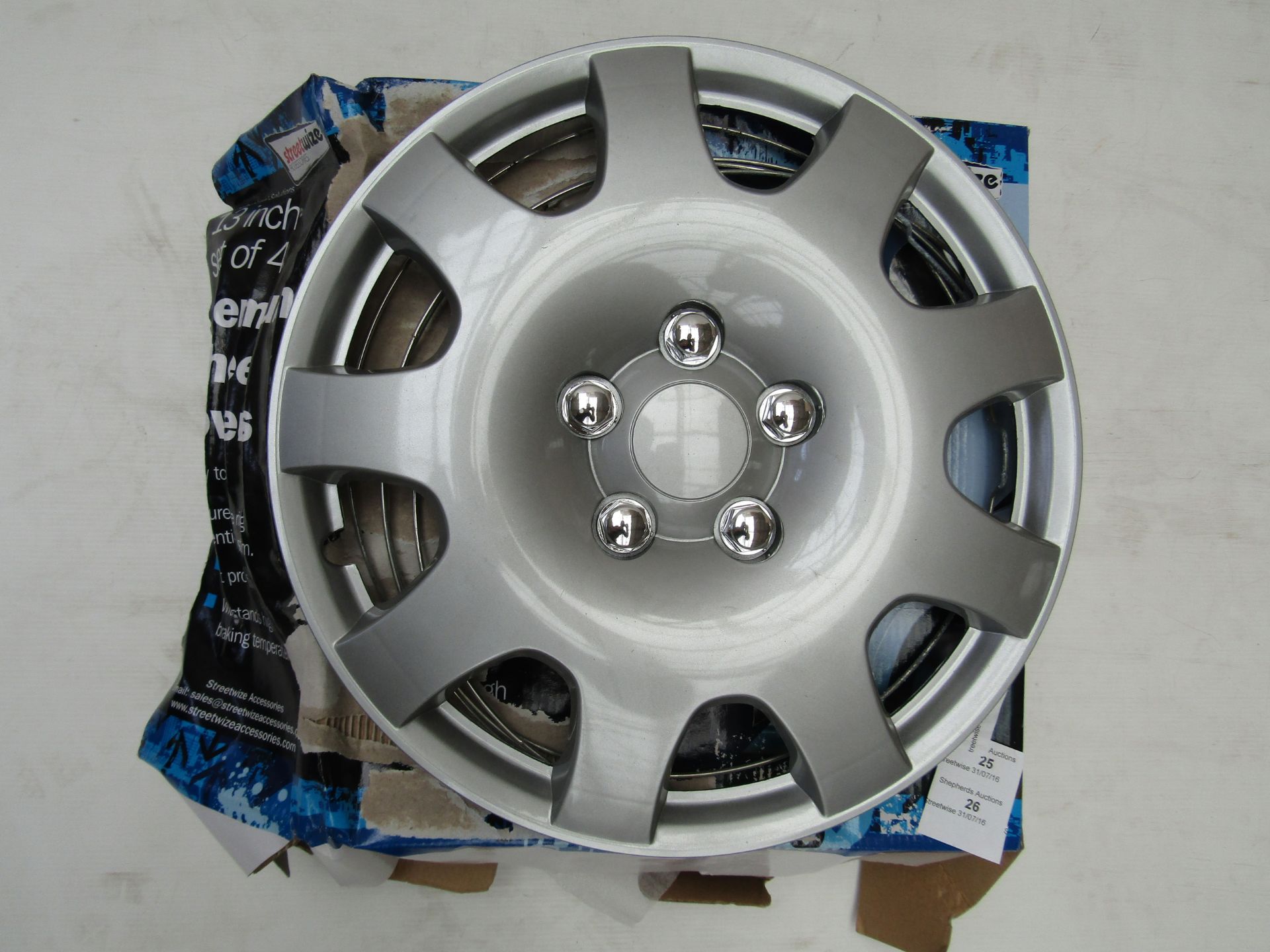 Set of StreetWize 13" Premium Wheel Covers. Brand New.  Packaging may have been wet at some point.