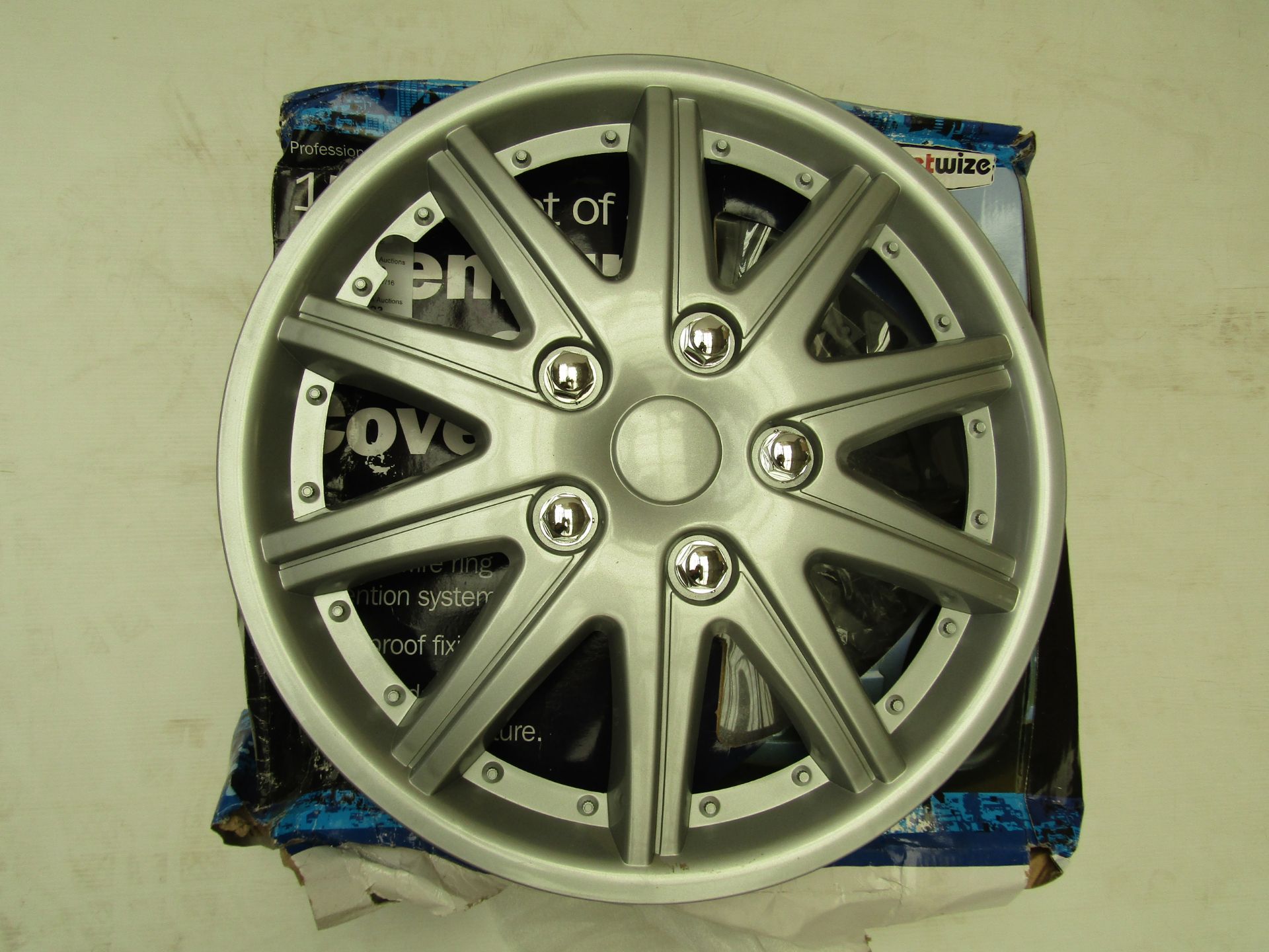 Set of StreetWize 15" Premium Wheel Covers. Brand New.  Packaging may have been wet at some point.