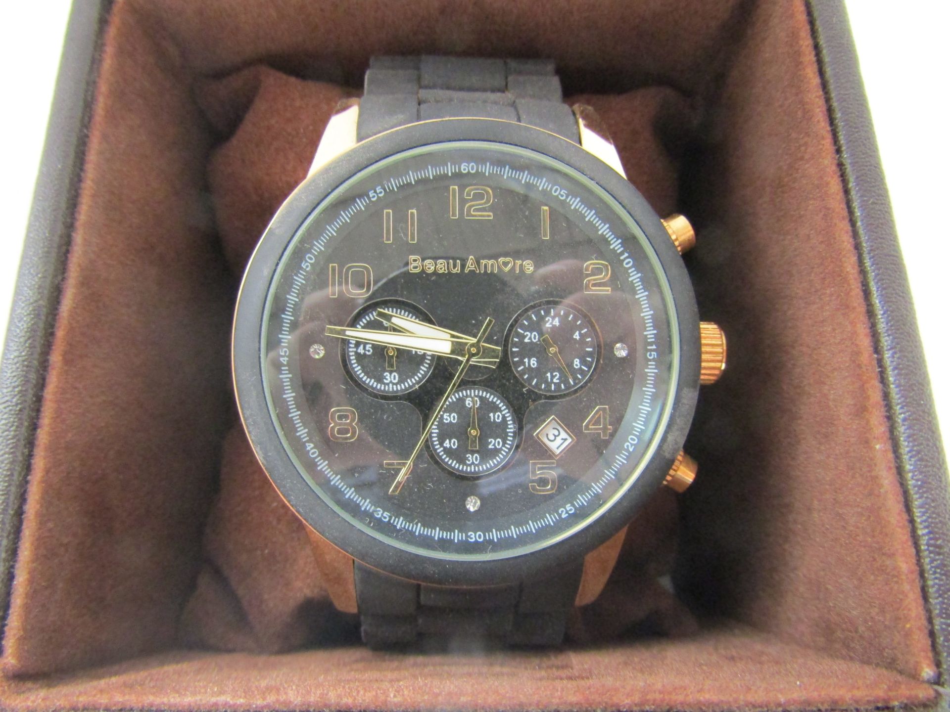 Beautiful Amore black and gold watch, new and ticking in presentation box