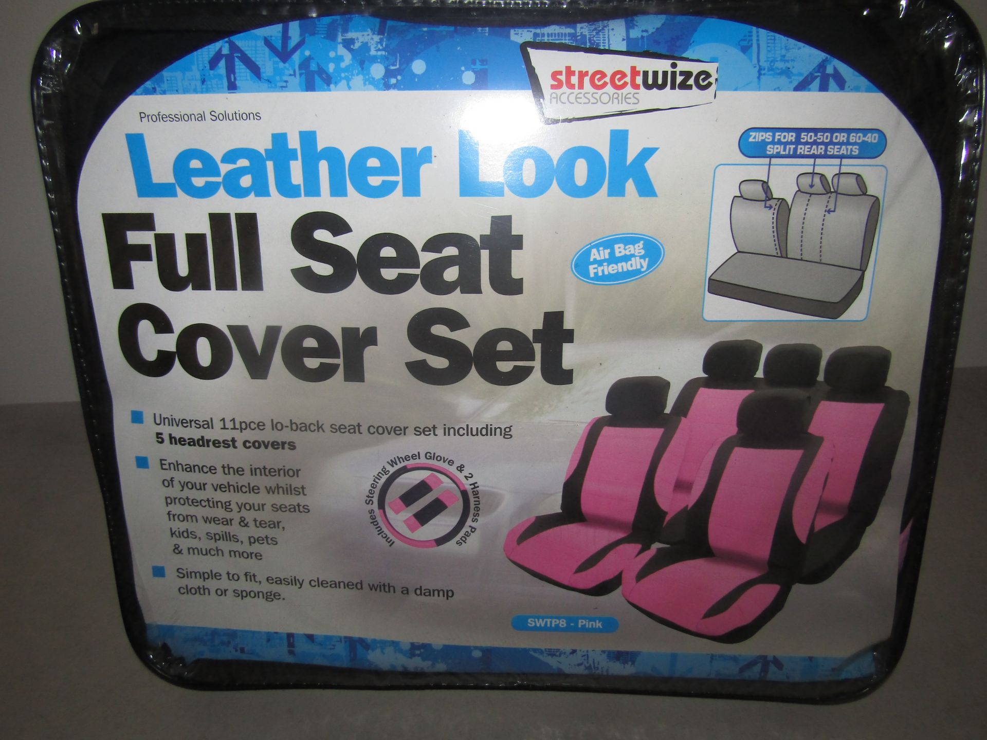 Leather look full seat cover set, pink colour, unused in carry case.