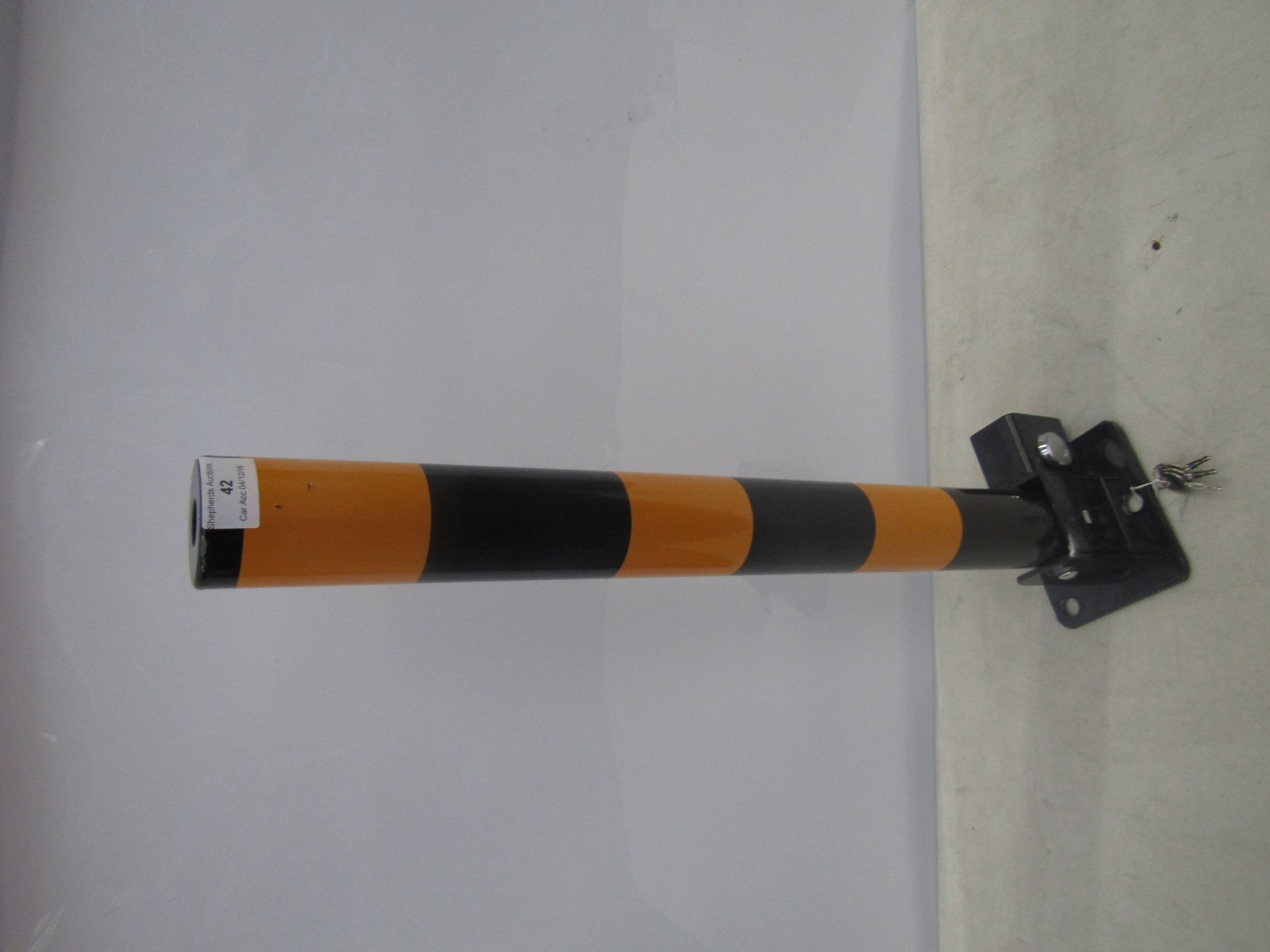 Heavy duty folding parking post, lockable and with keys.