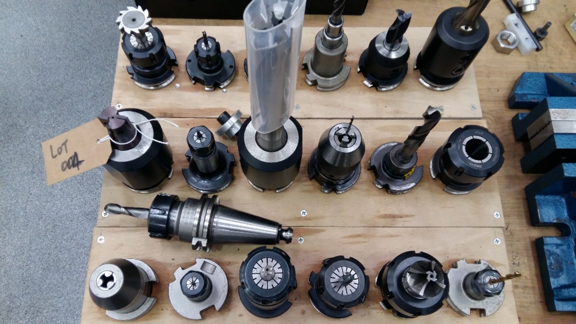 Assorted machine tooling (on workbench by Hurco VMX64)