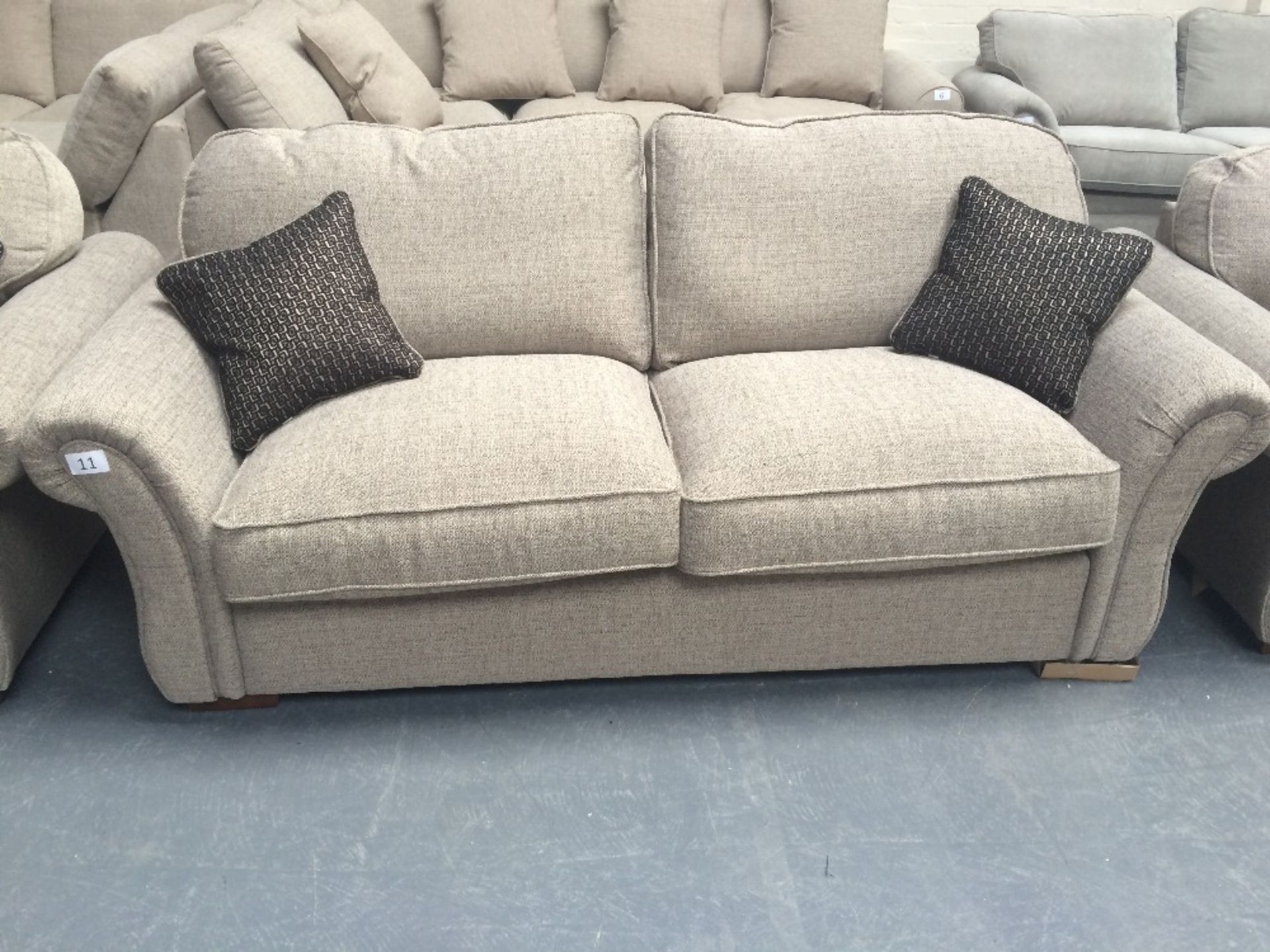 Light Brown Upholstered Three Seater Sofa