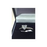 A STUNNING HEART SHAPED DIAMOND SOLITAIRE RING (I VS) GIVING OFF EXCELLENT SPARKLE & LIFE SET INTO A