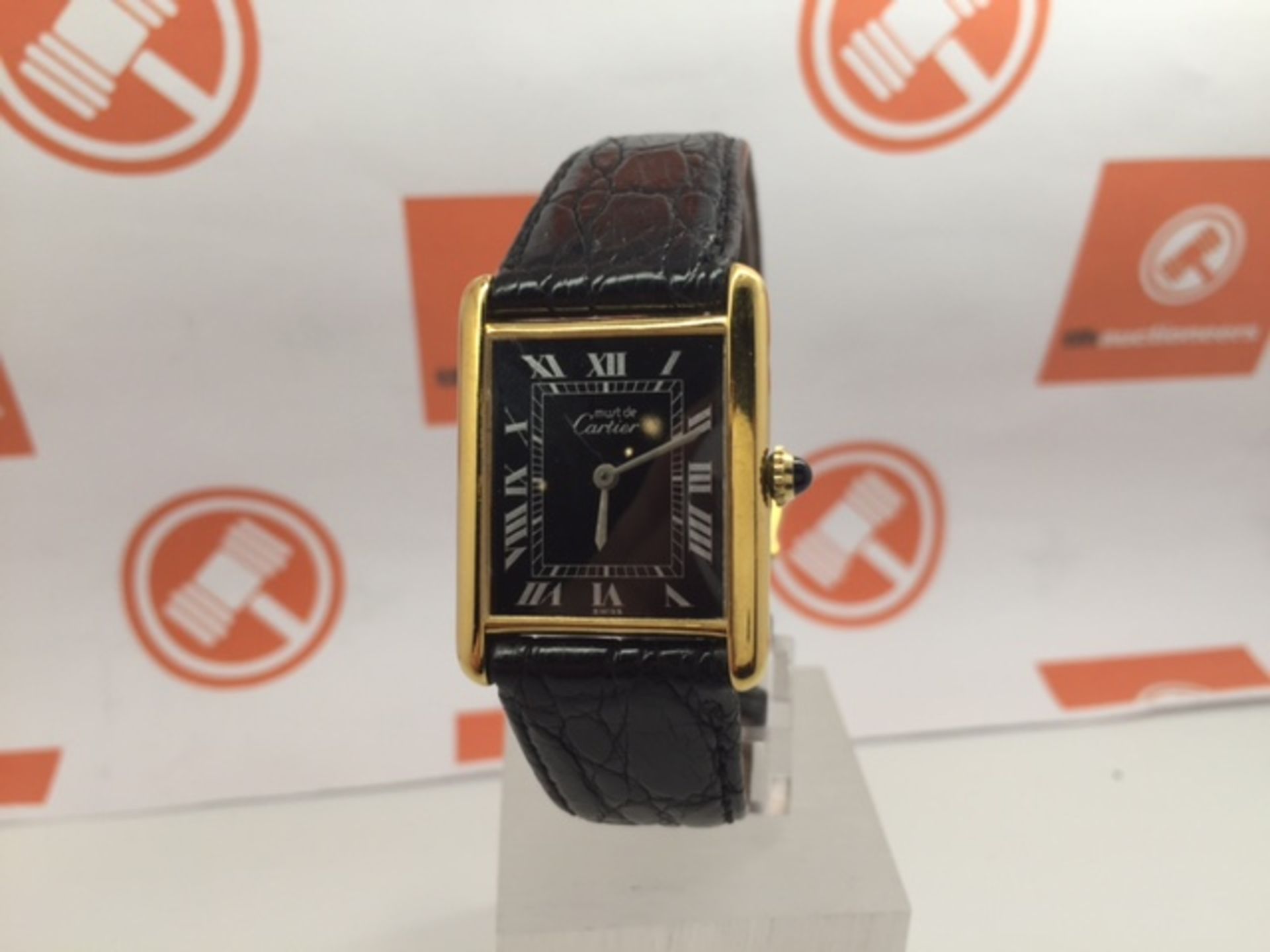 CARTIER GOLD PLATED WRIST WATCH ON LEATHER STRAP IN GOOD CONDITION SET WITH SAPPHIRE CABASCHON