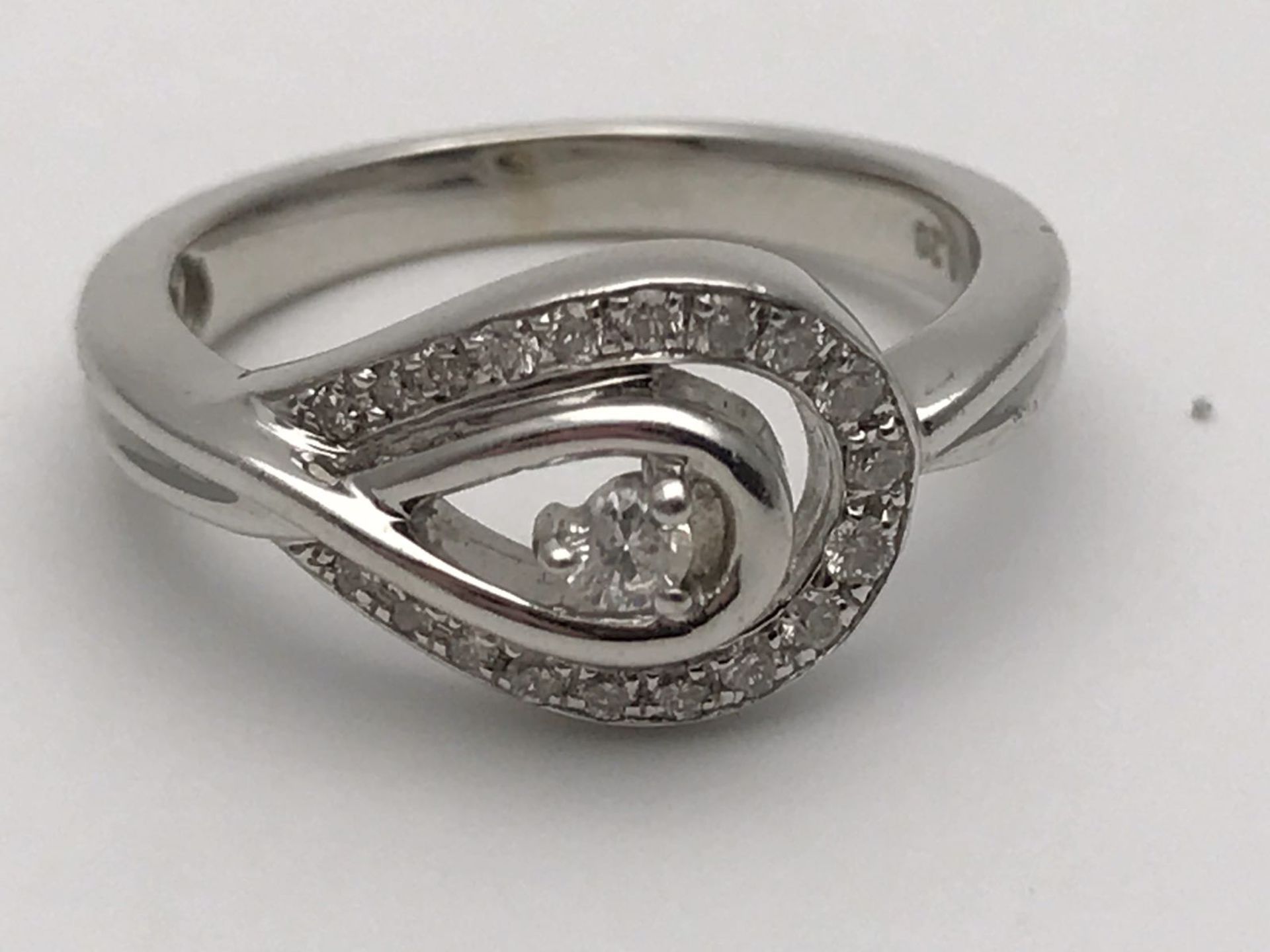 RRP £2500 A WHITE GOLD DIAMOND RING MADE TO FORM A LOOP & SET WITH HIGH QUALITY DIAMONDS GIVING - Image 3 of 4