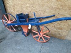 Single row pedestrian wheeled drill painted blue and orange