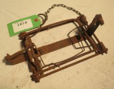 Unusual wire treadle rabbit trap stamped 'Cosey Patent No. 2712707' on stock bar