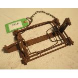 Unusual wire treadle rabbit trap stamped 'Cosey Patent No. 2712707' on stock bar