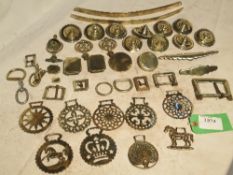 A large quantity of horse brasses including bell terrets, fly terrets, rein holders etc