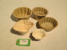 5 earthenware glassed jelly moulds