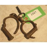 Gamekeeper's handcuffs (for a boy), including key and marked Hiat's Best. Patented. Warranted