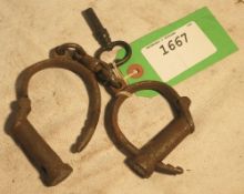 Gamekeeper's handcuffs (for a boy), including key and marked Hiat's Best. Patented. Warranted