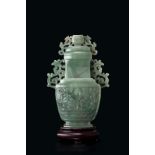 A hard-stone vase and cover, of archastic form, decorated in high relief with taotie masks, the