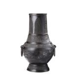 A bronze vase of archaistic shape, hu, with twin ring handles, decorated with geometric motifs and