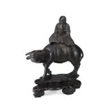 A bronze incense burner modelled as a long-bearded sage riding a buffalo, with wood base China,