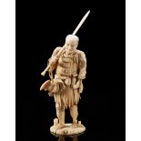 An ivory okimono of a standing figure Japan, early 20th century (h. 36 cm. senza la lancia / without