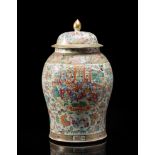 A large Cantonese Famille Rose baluster jar and cover decorated with figures in interiors (losses