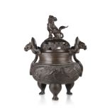 A bronze tripod censer and cover decorated with dragons and buddhist lions China, 20th century (h.