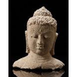 A grey stone buddha head (h. 33 cm.)