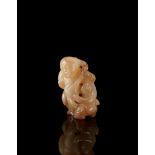 A small gray and russet jade carving of musicians (losses) China, 20th century (h. 5 cm.)