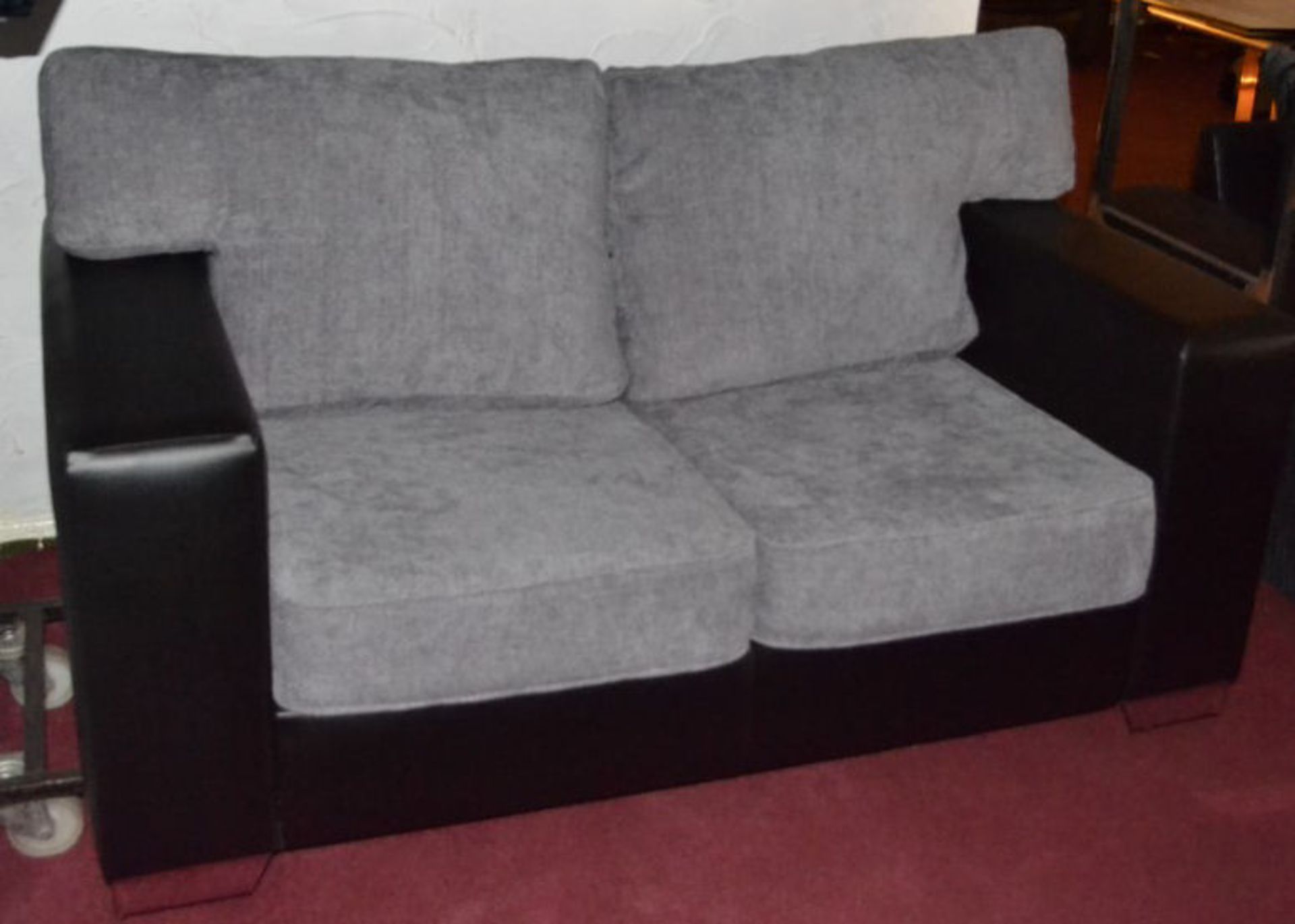 1 x 2-Seater Sofa In Black Faux Leather With Grey Fabric Cushions