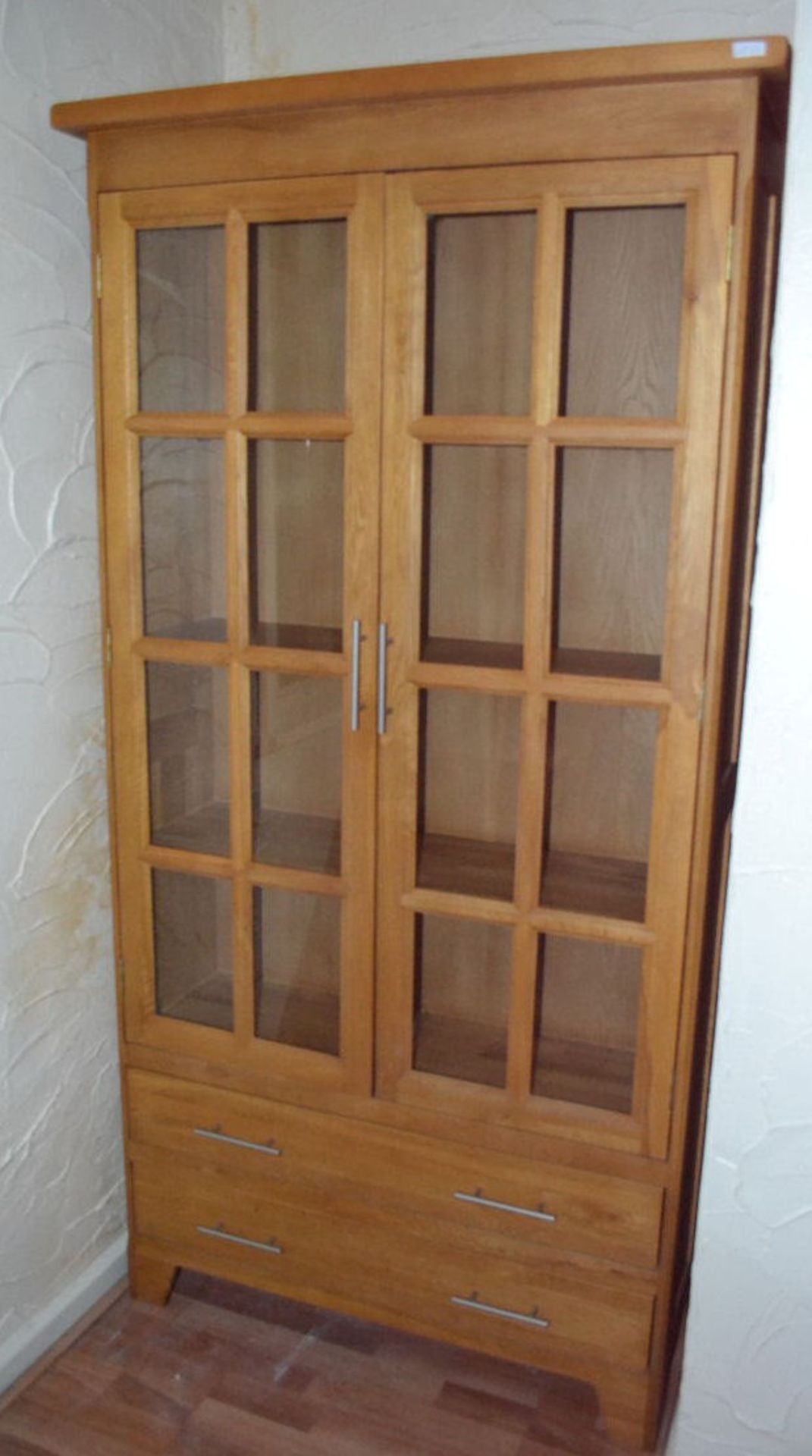1 x Province Oak Tall Display. Original Retail £1199. 2 Glass Doors. 192cm Height, 98.5cm Width