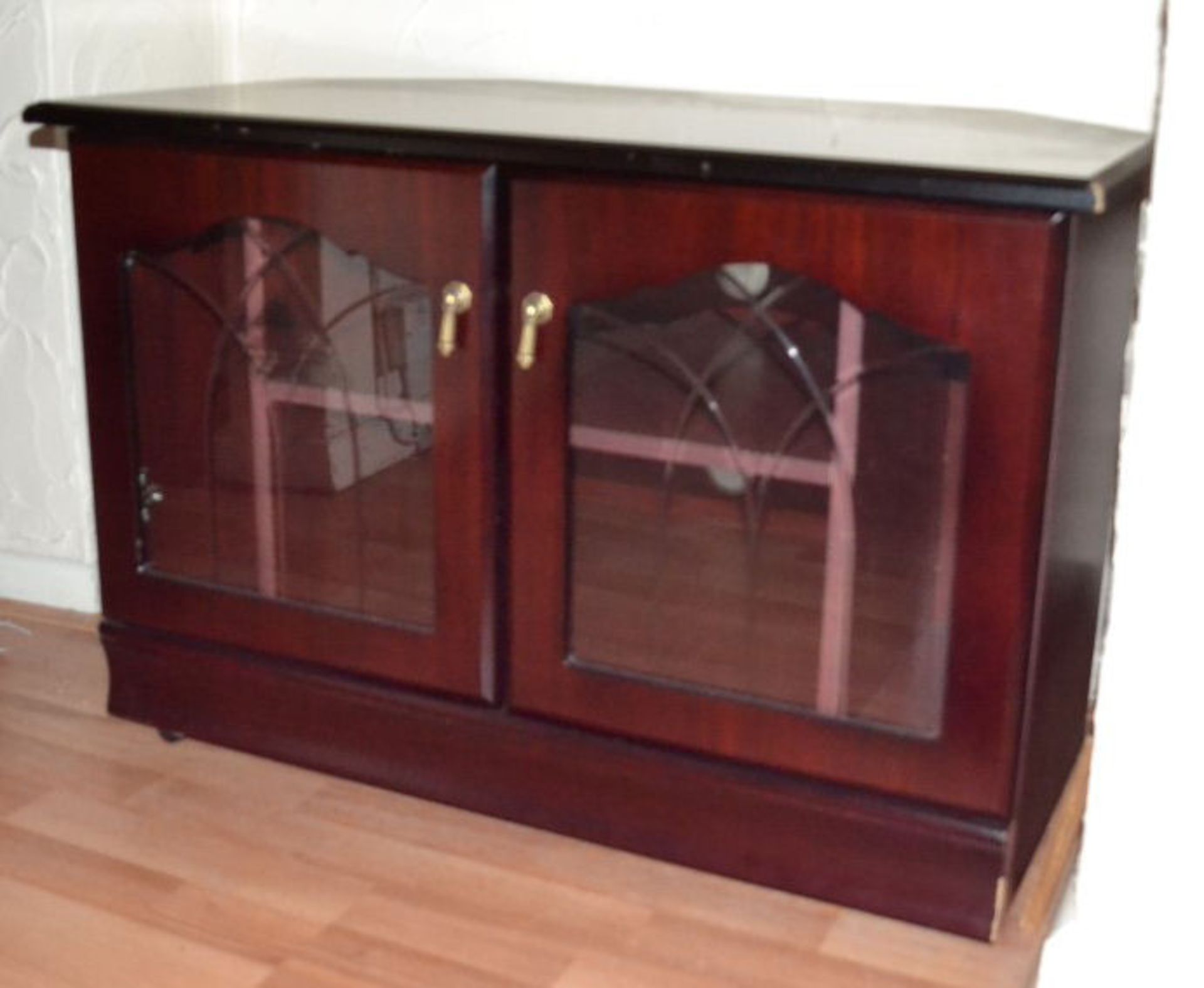 1 x TV Unit In Dark Wood. Slight Marks On Corners. Length 85cm. Depth 52.5cm. Height 58cm.