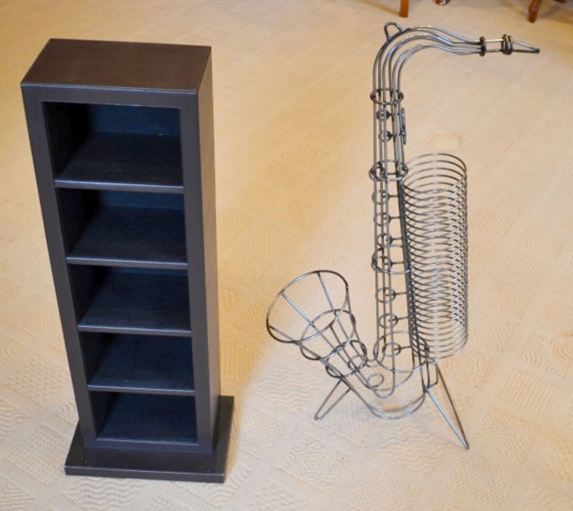 2 x CD Racks - Includes 1 x Saxaphone Shaped (H90cm), and 1 x In Faux Leather (H83cm)- Both From A