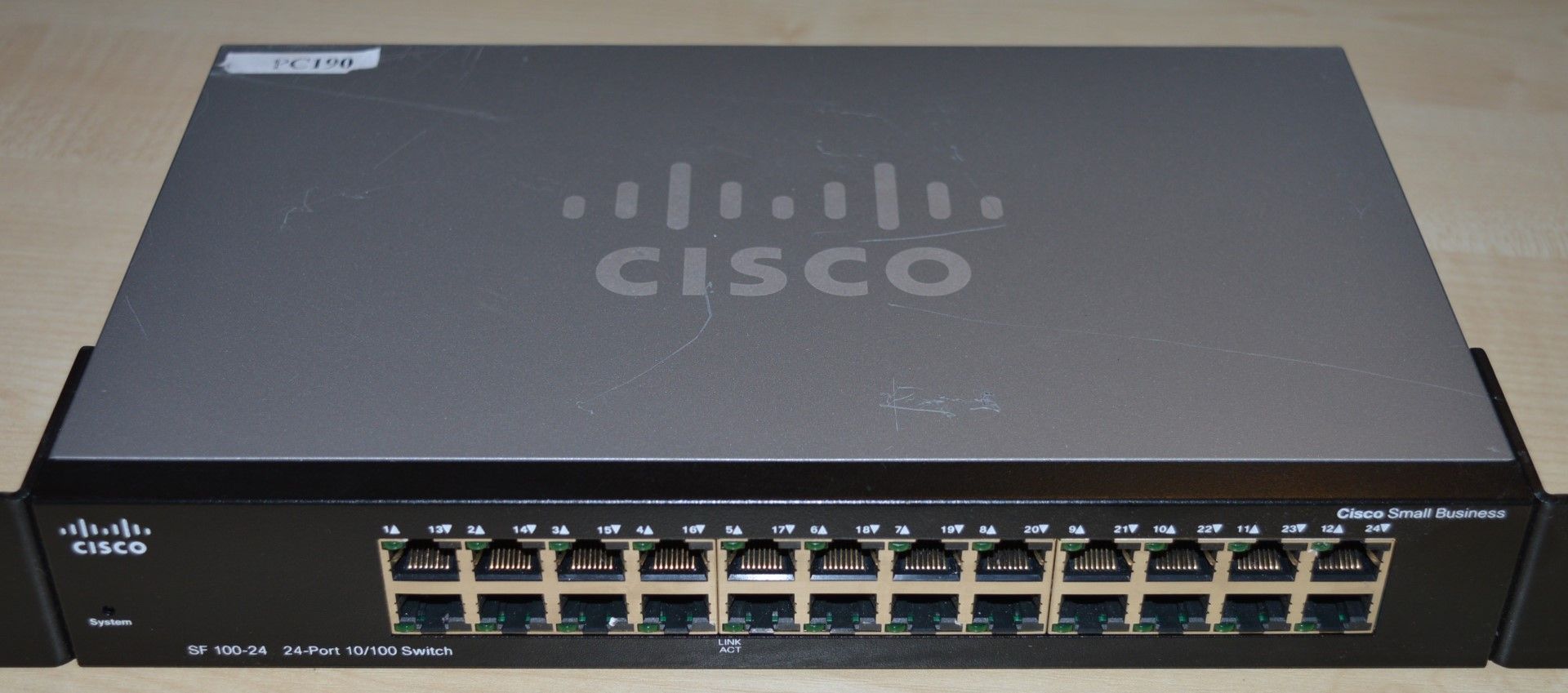 1 x Cisco SD 100-24 24 Port 10/100 Switch With Brackets - Ref PC190 - Location: Altrincham WA14