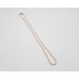 Collana di perle Ø 7mm. cm. 70 con fermaglio in oro 18Kt con zaffiro centrale e pietre bianche ai