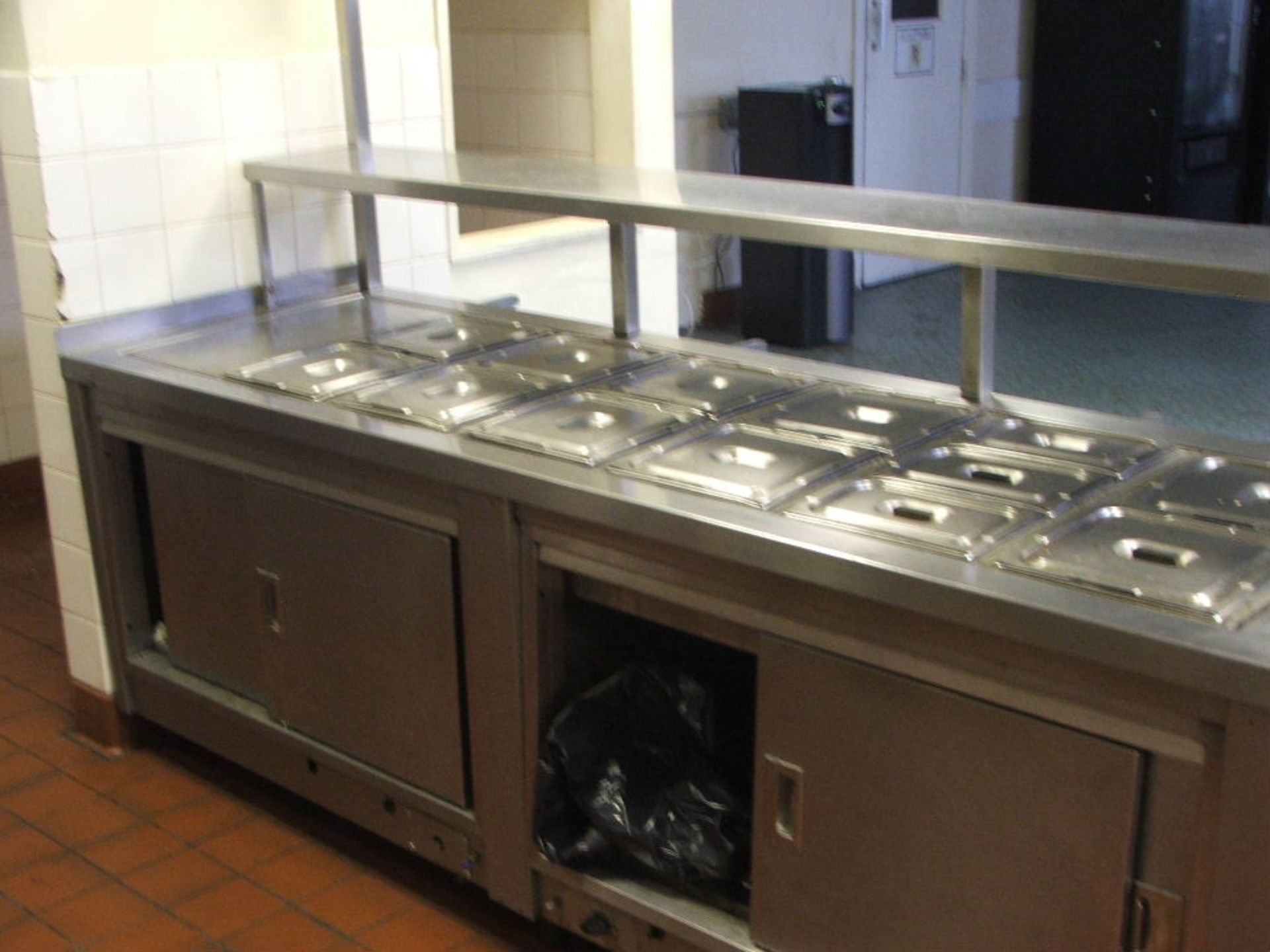 9 MTR LONG S/STEEL SERVING UNIT WITH BAIN MARRIE SERVING SELF HEAT LAMPS & WARMING CUPBOARDS