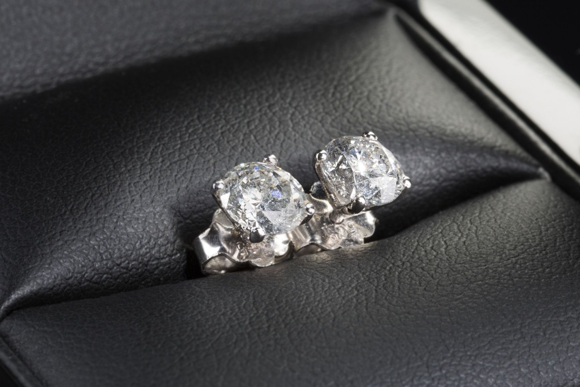 A New Pair of 1.57 ct Diamond Earrings D-E Colour Grade, SI1-SI2 Clarity Grade On a 14K Hallmarked