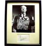 A Genuine Original Ink Signature of Alfred Hitchcock With His Trademark Line Drawing Above.