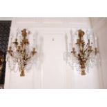 Pair of Louis XVI style Gilt Bronze Sconces mid 20th c., ribbon and urn form with five lights each