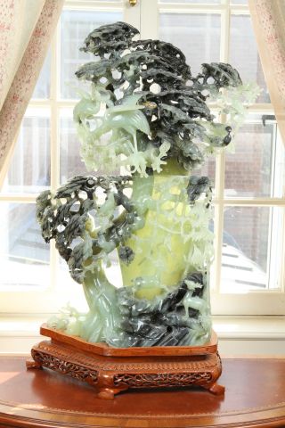 Monumental 20th c Chinese Jade Carving of tree with phoenix and animals on teak base. 30"h A few