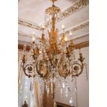 Empire style Gilt Bronze and Crystal Chandelier 19th century; impressive twelve light chandelier