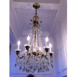 Gilt Metal and Crystal Six Light Chandelier early 20th c.; cascading crystals with tear drop form